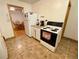 Functional kitchen with white appliances, ample counter space, and eat-in dining space at 2213 S Meade Street, Denver, CO 80219