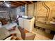 Basement laundry room with washer, dryer, and storage sink at 2213 S Meade Street, Denver, CO 80219