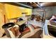 Basement laundry room with storage and yellow cabinets at 2213 S Meade Street, Denver, CO 80219