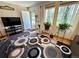 Cozy living room featuring wood-look floors, and an abundance of natural light at 2213 S Meade Street, Denver, CO 80219