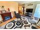 Comfortable living room featuring wood-look floors and a modern rug at 2213 S Meade Street, Denver, CO 80219