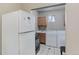 Laundry area with washer, dryer, refrigerator, and adjacent sink at 4024 W Kentucky Ave # A And B, Denver, CO 80219