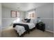 Serene primary bedroom with a calming color scheme, comfortable bed, and natural light at 9811 W 105Th Ave, Westminster, CO 80021