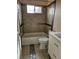 Bathroom featuring a tub, modern vanity, neutral tile and fixtures at 1390 Ash Ct, Thornton, CO 80229