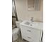 Modern bathroom showcasing a sleek white vanity, contemporary fixtures, and a clean, minimalist design at 1390 Ash Ct, Thornton, CO 80229