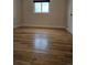 Spacious bedroom with beautiful hardwood floors, offering a bright and airy feel at 1390 Ash Ct, Thornton, CO 80229