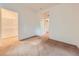 Spacious bedroom offers neutral carpet and access to the closet at 11316 Colony Cir, Broomfield, CO 80021