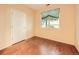 This bedroom features a light yellow walls, hardwood floors, and a window at 11316 Colony Cir, Broomfield, CO 80021