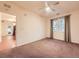 Bedroom with neutral carpet, a ceiling fan, and large window at 11316 Colony Cir, Broomfield, CO 80021