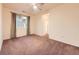 Cozy bedroom with neutral carpeting, a ceiling fan, and a double window at 11316 Colony Cir, Broomfield, CO 80021