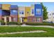 Colorful condo with brick accents, beautiful landscaping, and a well-maintained lawn at 11316 Colony Cir, Broomfield, CO 80021