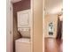 Convenient laundry closet featuring a stackable washer and dryer at 11316 Colony Cir, Broomfield, CO 80021