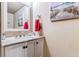 Bathroom with granite countertop and white cabinets at 4251 S Fairplay Cir # E, Aurora, CO 80014