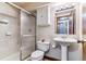 Basement bathroom with shower and pedestal sink at 4251 S Fairplay Cir # E, Aurora, CO 80014