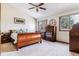 Spacious bedroom with wood furniture and large windows at 4251 S Fairplay Cir # E, Aurora, CO 80014