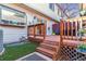 Backyard deck with steps and a small grassy area at 4251 S Fairplay Cir # E, Aurora, CO 80014