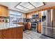 Kitchen with stainless steel appliances and granite countertops at 4251 S Fairplay Cir # E, Aurora, CO 80014