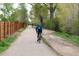 Scenic bike path surrounded by lush greenery, promoting an active outdoor lifestyle at 2140 S Ash St # 104, Denver, CO 80222