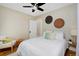 Bedroom with queen-size bed, ceiling fan and hardwood floors at 1445 Elm St, Denver, CO 80220