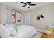 Bedroom with queen-size bed, ceiling fan and hardwood floors at 1445 Elm St, Denver, CO 80220