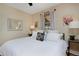 Main bedroom with king-size bed, hardwood floors and neutral decor at 1445 Elm St, Denver, CO 80220