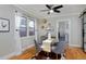 Dining area with glass table and gray velvet chairs at 1445 Elm St, Denver, CO 80220