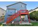 Home features a deck and stairs leading to a fenced backyard at 11220 Keota St, Parker, CO 80134