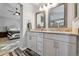 Elegant bathroom with double vanity and granite countertop at 11220 Keota St, Parker, CO 80134