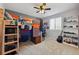 bedroom with bunk bed, sports theme, and guitar at 11220 Keota St, Parker, CO 80134