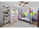 Charming bedroom with colorful wall decor and bookcase at 11220 Keota St, Parker, CO 80134