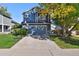 Two-story blue home with a two-car garage and basketball hoop at 11220 Keota St, Parker, CO 80134