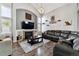 Spacious living room with vaulted ceiling, fireplace, and hardwood floors at 11220 Keota St, Parker, CO 80134