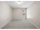 Well-lit bedroom with gray carpet and window at 3663 S Sheridan Blvd # 2, Denver, CO 80235