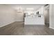 Dining area featuring gray vinyl flooring and chandelier at 3663 S Sheridan Blvd # 2, Denver, CO 80235