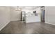 Dining area with gray vinyl flooring and kitchen access at 3663 S Sheridan Blvd # 2, Denver, CO 80235