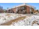 Building exterior view with snow covered lawn at 3663 S Sheridan Blvd # 2, Denver, CO 80235