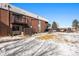 Brick building exterior with stairs leading to private balconies at 3663 S Sheridan Blvd # 2, Denver, CO 80235