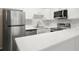 Modern kitchen with stainless steel appliances and white cabinets at 3663 S Sheridan Blvd # 2, Denver, CO 80235