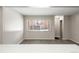 Bright living room features a large window and neutral paint, creating an inviting atmosphere at 3663 S Sheridan Blvd # 2, Denver, CO 80235
