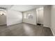 Living room featuring gray vinyl flooring and ample natural light at 3663 S Sheridan Blvd # 2, Denver, CO 80235