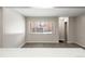 Spacious living room with large window and gray flooring at 3663 S Sheridan Blvd # 2, Denver, CO 80235