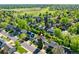 Aerial view of home, lush greenery and a view of the golf course in the distance at 6829 S Niagara Ct, Centennial, CO 80112