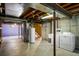 Spacious unfinished basement with washer, dryer and utility sink, ready for customization at 6829 S Niagara Ct, Centennial, CO 80112