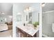 Elegant bathroom with marble vanity, modern fixtures, and a glass-enclosed shower at 6829 S Niagara Ct, Centennial, CO 80112