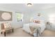 Inviting bedroom featuring soft colors, white bedding and natural light from shuttered windows at 6829 S Niagara Ct, Centennial, CO 80112