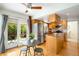 Eat-in kitchen with stainless steel appliances and access to the outdoor patio at 6829 S Niagara Ct, Centennial, CO 80112