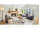 Bright living room with fireplace, comfortable seating, and modern accents at 6829 S Niagara Ct, Centennial, CO 80112