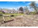 Expansive backyard featuring a garden area, shed, and ample space for outdoor activities and landscaping at 5085 E Missouri Ave, Denver, CO 80246