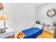 Bright bedroom with hardwood floors and minimalist decor creating a calming and inviting space at 5085 E Missouri Ave, Denver, CO 80246
