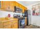Kitchen featuring stainless steel appliances, wood cabinets, and slate tile flooring at 5085 E Missouri Ave, Denver, CO 80246